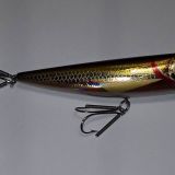 A close up of a fishing lure with a hook