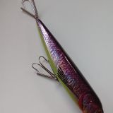 A close up of a fishing lure with two hooks