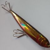 A fishing lure with two hooks attached to it.